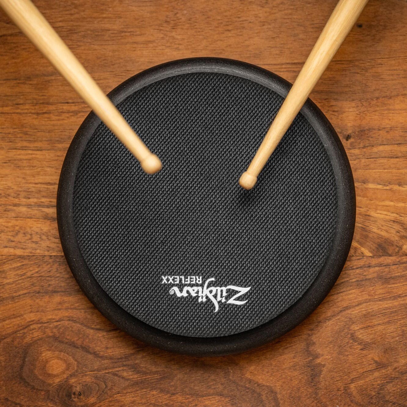 Black Zildjian Reflexx pads being played